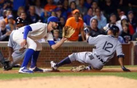 Aug 19, 2015; Chicago, IL, USA; Detroit Tigers center fielder Anthony Gose (12) slides into third base ahead of the throw to Chicago Cubs third baseman Kris Bryant (left) for a RBI triple during the eighth inning at Wrigley Field. Mandatory Credit: Jerry Lai-USA TODAY Sports