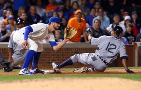 Aug 19, 2015; Chicago, IL, USA; Detroit Tigers center fielder Anthony Gose (12) slides into third base ahead of the throw to Chicago Cubs third baseman Kris Bryant (left) for a RBI triple during the eighth inning at Wrigley Field. Mandatory Credit: Jerry Lai-USA TODAY Sports