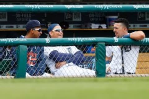 Apr 19, 2015; Detroit, MI, USA; Detroit Tigers center fielder Anthony Gose (12) first baseman Miguel Cabrera (24) and second baseman Hernan Perez (26) in the dugout against the Chicago White Sox at Comerica Park. Mandatory Credit: Rick Osentoski-USA TODAY Sports