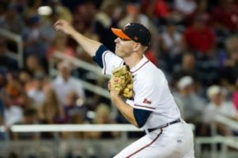 Jun 15, 2014; Omaha, NE, USA; Virginia Cavaliers pitcher Artie Lewicki (34) pitches in relief against the Mississippi Rebels during game four of the 2014 College World Series at TD Ameritrade Park Omaha. Virginia defeated Mississippi 2-1. Mandatory Credit: Steven Branscombe-USA TODAY Sports