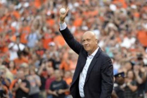 Sep 1, 2015; Baltimore, MD, USA; Baltimore Orioles former players Cal Ripken Jr. waves to the crowd before throwing out the first pitch on the 20th anniversary of breaking Lou Gehrig