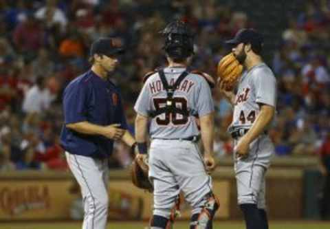 Sep 29, 2015; Arlington, TX, USA; Detroit Tigers manager Brad Ausmus (left) takes out starting pitcher Daniel Norris (44) during the game against the Texas Rangers at Globe Life Park in Arlington. Mandatory Credit: Kevin Jairaj-USA TODAY Sports