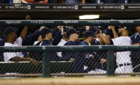 Sep 12, 2014; Detroit, MI, USA; Detroit Tigers starting pitcher David Price (R) is greeting by teammates in the dugout after being relieved in the eighth inning against the Cleveland Indians at Comerica Park. Mandatory Credit: Rick Osentoski-USA TODAY Sports