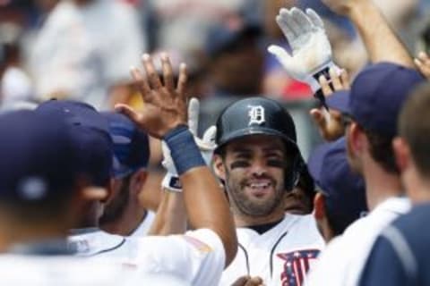 Jul 4, 2015; Detroit, MI, USA; Detroit Tigers right fielder J.D. Martinez (28) receives congratulations from teammates after he hits a two run home run in the first inning against the Toronto Blue Jays at Comerica Park. Mandatory Credit: Rick Osentoski-USA TODAY Sports