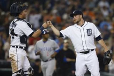 Jun 9, 2015; Detroit, MI, USA; Detroit Tigers catcher James McCann (34) and relief pitcher Alex Wilson (30) celebrate after the game against the Chicago Cubs at Comerica Park. Detroit won 6-0. Mandatory Credit: Rick Osentoski-USA TODAY Sports