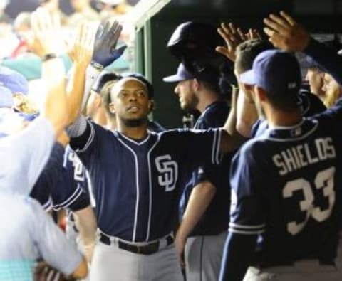 Aug 26, 2015; Washington, DC, USA; San Diego Padres left fielder Justin Upton (10) is congratulated by teammates after hitting a solo homer against the Washington Nationals during the seventh inning at Nationals Park. The San Diego Padres won 6-5. Mandatory Credit: Brad Mills-USA TODAY Sports