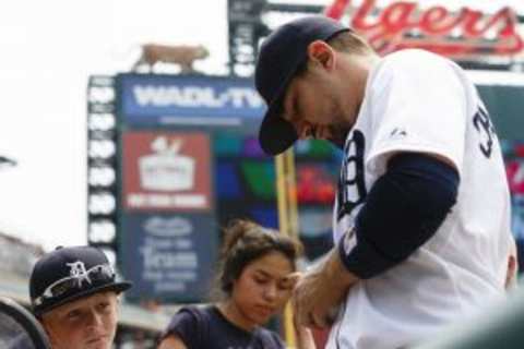 Jul 5, 2015; Detroit, MI, USA; Detroit Tigers third baseman Nick Castellanos (9) signs autographs for young fans prior to the game against the Toronto Blue Jays at Comerica Park. Mandatory Credit: Rick Osentoski-USA TODAY Sports