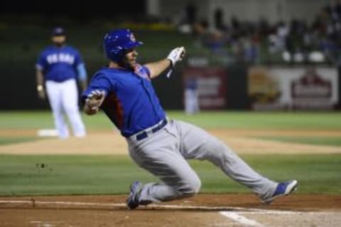 Mar 18, 2014; Surprise, AZ, USA; Chicago Cubs catcher Rafael Lopez (82) slides at home plate to score a run in the third inning against the Texas Rangers at Surprise Stadium. Mandatory Credit: Joe Camporeale-USA TODAY Sports