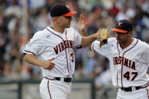 Jun 25, 2014; Omaha, NE, USA; Virginia Cavaliers pitcher Whit Mayberry (47) congratulates pitcher Artie Lewicki (34) in the second inning against the Vanderbilt Commodores during game three of the College World Series Finals at TD Ameritrade Park Omaha. Mandatory Credit: Bruce Thorson-USA TODAY Sports