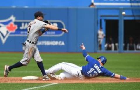 Aug 29, 2015; Toronto, Ontario, CAN; Detroit Tigers second baseman Ian Kinsler (3) throws to first to complete a double play after forcing out Toronto Blue Jays first baseman Justin Smoak (13) in the third inning at Rogers Centre. Mandatory Credit: Dan Hamilton-USA TODAY Sports