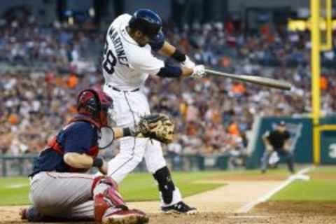 Aug 7, 2015; Detroit, MI, USA; Detroit Tigers right fielder J.D. Martinez (28) hits a a two run home run in the fourth inning against the Boston Red Sox at Comerica Park. Mandatory Credit: Rick Osentoski-USA TODAY Sports