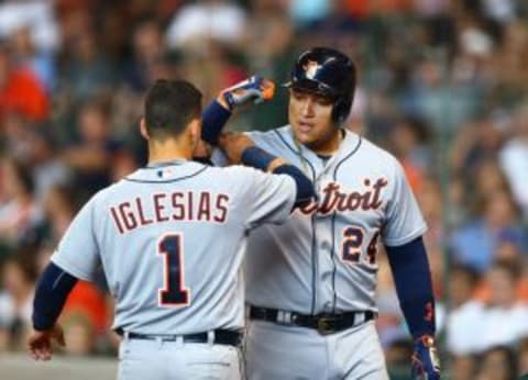 Aug 16, 2015; Houston, TX, USA; Detroit Tigers first baseman Miguel Cabrera (right) flexes his arm as he celebrates with teammate Jose Iglesias after hitting a two run home run in the seventh inning against the Houston Astros at Minute Maid Park. Mandatory Credit: Mark J. Rebilas-USA TODAY Sports