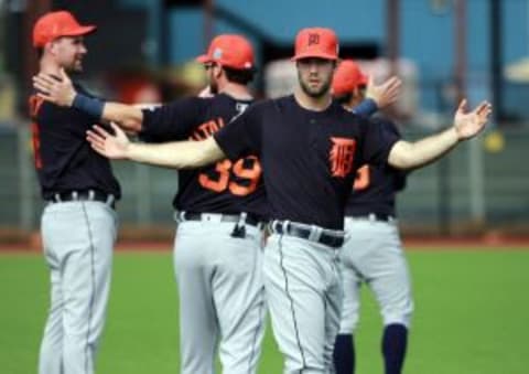 Feb 21, 2016; Lakeland, FL, USA; Detroit Tigers starting pitcher Daniel Norris (44), catcher Jarrod Saltalamacchia and starting pitcher Mike Pelfrey (37) stretch before practice at Joker Marchant Stadium. Mandatory Credit: Kim Klement-USA TODAY Sports