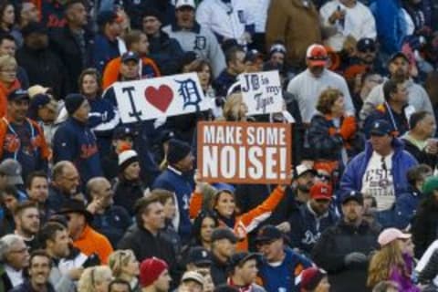 Oct 5, 2014; Detroit, MI, USA; Detroit Tigers fans and hold up signs against the Baltimore Orioles during game three of the 2014 ALDS baseball playoff game at Comerica Park. Mandatory Credit: Rick Osentoski-USA TODAY Sports