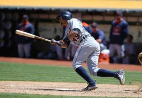 May 27, 2015; Oakland, CA, USA; Detroit Tigers shortstop Dixon Machado (49) hits his first major league hits against the Oakland Athletics] during the sixth inning at O.co Coliseum. Mandatory Credit: Kelley L Cox-USA TODAY Sports