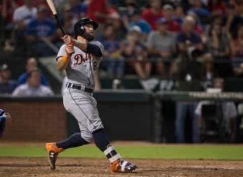 Sep 28, 2015; Arlington, TX, USA; Detroit Tigers left fielder Tyler Collins (18) hits a three run home run during the fifth inning against the Texas Rangers at Globe Life Park in Arlington. Mandatory Credit: Jerome Miron-USA TODAY Sports