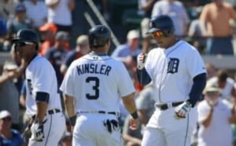 Mar 4, 2016; Lakeland, FL, USA; Detroit Tigers first baseman Miguel Cabrera (24) is congratulated by second baseman Ian Kinsler (3) and center fielder Anthony Gose (12) after hitting a three-run home run during the third inning against the New York Yankees at Joker Marchant Stadium. Mandatory Credit: Kim Klement-USA TODAY Sports