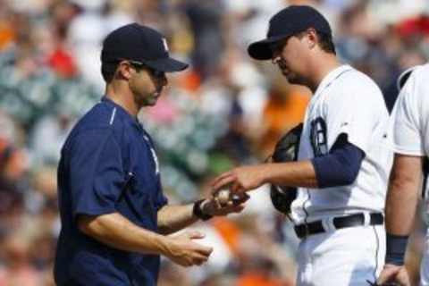 Aug 23, 2015; Detroit, MI, USA; Detroit Tigers manager Brad Ausmus (7) takes the ball to relieve pitcher Blaine Hardy (65) in the eighth inning against the Texas Rangers at Comerica Park. Mandatory Credit: Rick Osentoski-USA TODAY Sports