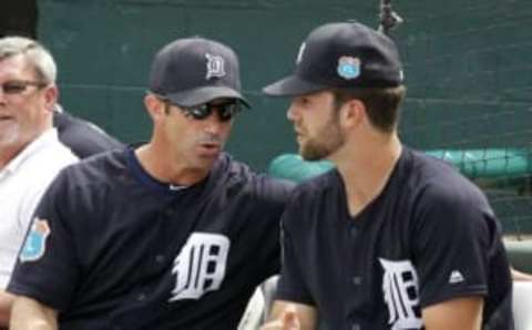 Mar 14, 2016; Lakeland, FL, USA; Detroit Tigers manager Brad Ausmus and pitcher Daniel Norris (right) talk during the third inning of a spring training baseball game against the New York Mets at Joker Marchant Stadium. Mandatory Credit: Reinhold Matay-USA TODAY Sports