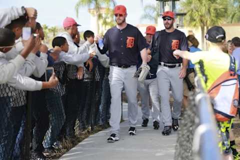 Feb 21, 2016; Lakeland, FL, USA; Detroit Tigers pitcher Mark Lowe (21) and starting pitcher Justin Verlander (35) high five fans on their way to practice at Joker Marchant Stadium. Mandatory Credit: Kim Klement-USA TODAY Sports