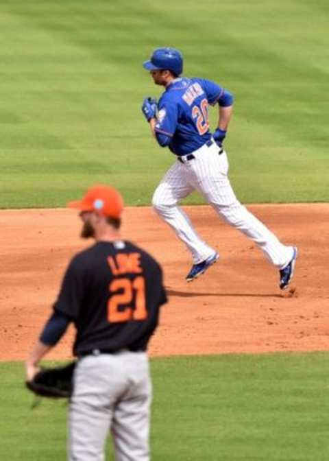 Mar 7, 2016; Port St. Lucie, FL, USA; New York Mets second baseman Neil Walker (20) rounds the bases after hitting a solo home run off of Detroit Tigers relief pitcher Mark Lowe (21) during a spring training game at Tradition Field. Mandatory Credit: Steve Mitchell-USA TODAY Sports