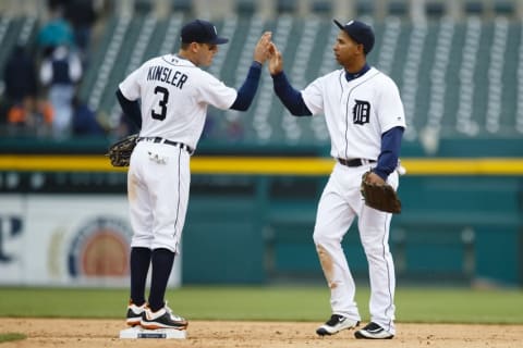 Apr 28, 2016; Detroit, MI, USA; Detroit Tigers second baseman Ian Kinsler (3) and center fielder Anthony Gose (12) celebrate after the game against the Oakland Athletics at Comerica Park. Detroit won 7-3. Mandatory Credit: Rick Osentoski-USA TODAY Sports