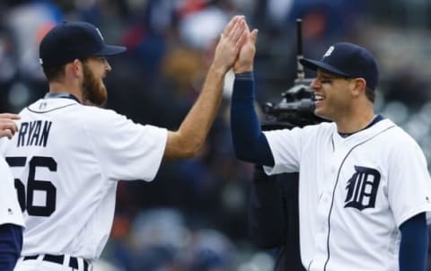 Apr 8, 2016; Detroit, MI, USA; Detroit Tigers relief pitcher Blaine Hardy (65) and second baseman Ian Kinsler (3) celebrate after the game against the New York Yankees at Comerica Park. Detroit won 4-0. Mandatory Credit: Rick Osentoski-USA TODAY Sports