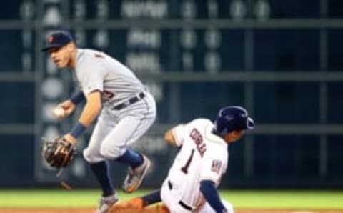 Aug 16, 2015; Houston, TX, USA; Houston Astros base runner Carlos Correa (right) is forced out at second base by Detroit Tigers infielder Ian Kinsler in the second inning at Minute Maid Park. Mandatory Credit: Mark J. Rebilas-USA TODAY Sports