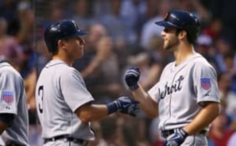 Aug 19, 2015; Chicago, IL, USA; Detroit Tigers starting pitcher Daniel Norris (right) celebrates with second baseman Ian Kinsler (3) after hitting a two-run home run against the Chicago Cubs during the second inning at Wrigley Field. Mandatory Credit: Jerry Lai-USA TODAY Sports