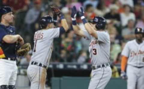 Apr 17, 2016; Houston, TX, USA; Detroit Tigers second baseman Ian Kinsler (3) celebrates with shortstop Jose Iglesias (1) after hitting a home run against the Houston Astros during the fifth inning at Minute Maid Park. Mandatory Credit: Troy Taormina-USA TODAY Sports