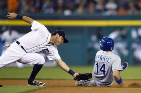 Sep 9, 2014; Detroit, MI, USA; Kansas City Royals second baseman Omar Infante (14) steals second base ahead outfield the tag by Detroit Tigers second baseman Ian Kinsler (3) in the seventh inning at Comerica Park. Detroit won 4-2. Mandatory Credit: Rick Osentoski-USA TODAY Sports