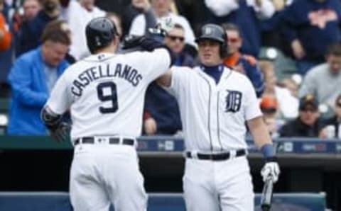 Apr 11, 2016; Detroit, MI, USA; Detroit Tigers third baseman Nick Castellanos (9) receives congratulations from catcher James McCann (34) after hitting a home run in the second inning against the Pittsburgh Pirates at Comerica Park. Mandatory Credit: Rick Osentoski-USA TODAY Sports