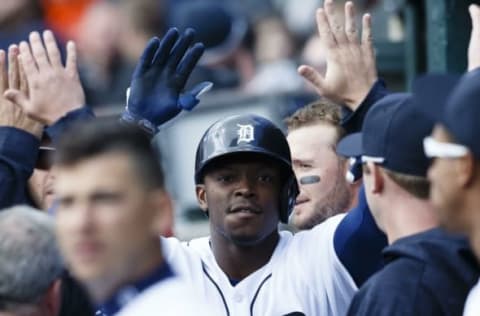 Apr 12, 2016; Detroit, MI, USA; Detroit Tigers left fielder Justin Upton (8) receives congratulations from teammates after he hits a home run in the first inning against the Pittsburgh Pirates at Comerica Park. Mandatory Credit: Rick Osentoski-USA TODAY Sports