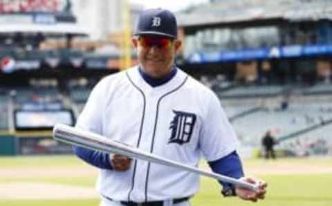 Apr 12, 2016; Detroit, MI, USA; Detroit Tigers first baseman Miguel Cabrera (24) with his Silver Bat as 2015 American League batting champion before the game against the Pittsburgh Pirates at Comerica Park. Mandatory Credit: Rick Osentoski-USA TODAY Sports