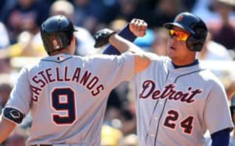 Apr 14, 2016; Pittsburgh, PA, USA; Detroit Tigers third baseman Nick Castellanos (9) is greeted at home plate by first baseman Miguel Cabrera (24) after Castellanos hit a two-run home run against the Pittsburgh Pirates during the eighth inning in an interleague game at PNC Park. Mandatory Credit: Charles LeClaire-USA TODAY Sports