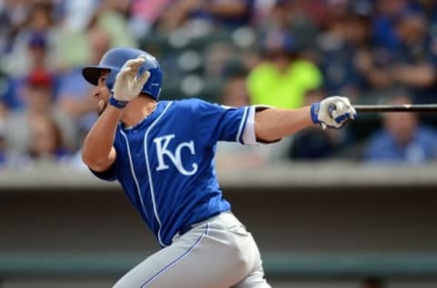 Mar 7, 2016; Mesa, AZ, USA; Kansas City Royals second baseman Omar Infante (14) swings the bat during the second inning against the Chicago Cubs at Sloan Park. Mandatory Credit: Joe Camporeale-USA TODAY Sports