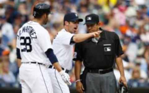 May 7, 2016; Detroit, MI, USA; Detroit Tigers manager Brad Ausmus (7) argues a call with umpire Alfonso Marquez (R) during the eighth inning against the Texas Rangers at Comerica Park. Mandatory Credit: Rick Osentoski-USA TODAY Sports