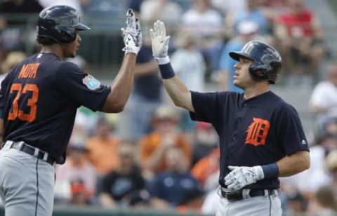 Mar 16, 2016; Kissimmee, FL, USA; Detroit Tigers second baseman Ian Kinsler (3) is congratulated by Tigers Steven Moya (33) after hitting a solo home run during the sixth inning of a spring training baseball game against the Houston Astros at Osceola County Stadium. The Tigers won 7-3. Mandatory Credit: Reinhold Matay-USA TODAY Sports