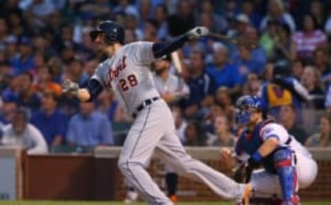 Aug 18, 2015; Chicago, IL, USA; Detroit Tigers right fielder J.D. Martinez hits a two-run home run against the Chicago Cubs during the first inning at Wrigley Field. Mandatory Credit: Jerry Lai-USA TODAY Sports