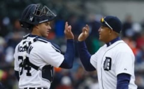 Apr 8, 2016; Detroit, MI, USA; Detroit Tigers catcher James McCann (34) and first baseman Miguel Cabrera (24) celebrate after the game against the New York Yankees at Comerica Park. Detroit won 4-0. Mandatory Credit: Rick Osentoski-USA TODAY Sports