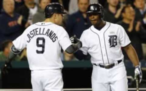 May 16, 2016; Detroit, MI, USA; Detroit Tigers third baseman Nick Castellanos (9) receives congratulations from left fielder Justin Upton (8) after he hits a home run in the seventh inning against the Minnesota Twins at Comerica Park. Mandatory Credit: Rick Osentoski-USA TODAY Sports