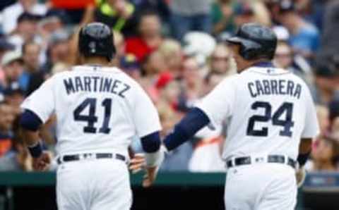 May 7, 2016; Detroit, MI, USA; Detroit Tigers designated hitter Victor Martinez (41) and first baseman Miguel Cabrera (24) celebrate after scoring runs in the third inning against the Texas Rangers at Comerica Park. Mandatory Credit: Rick Osentoski-USA TODAY Sports