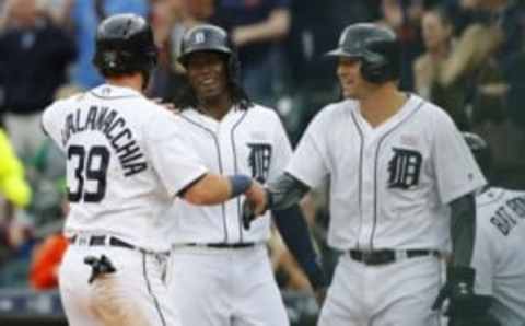 May 16, 2016; Detroit, MI, USA; Detroit Tigers catcher Jarrod Saltalamacchia (39) center fielder Cameron Maybin (4) and third baseman Nick Castellanos (9) congratulate each other after scoring in the first inning against the Minnesota Twins at Comerica Park. Mandatory Credit: Rick Osentoski-USA TODAY Sports