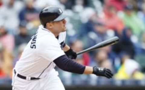 Apr 28, 2016; Detroit, MI, USA; Detroit Tigers third baseman Nick Castellanos (9) hits an RBI double in the third inning against the Oakland Athletics at Comerica Park. Mandatory Credit: Rick Osentoski-USA TODAY Sports