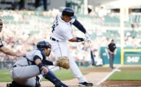 Jun 2, 2016; Detroit, MI, USA; Detroit Tigers first baseman Miguel Cabrera (24) hits a single in the first inning against the New York Yankees at Comerica Park. Mandatory Credit: Rick Osentoski-USA TODAY Sports