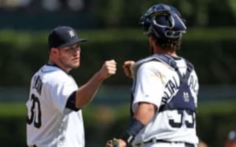 May 22, 2016; Detroit, MI, USA; Detroit Tigers relief pitcher Alex Wilson (30) and catcher Jarrod Saltalamacchia (39) celebrate a win over the Tampa Bay Rays at Comerica Park. The Tigers defeated the Rays 9-4. Mandatory Credit: Leon Halip-USA TODAY Sports