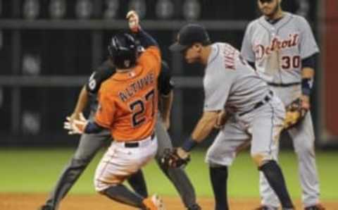 Jun 27, 2014; Houston, TX, USA; Houston Astros second baseman Jose Altuve (27) slides safely into second base with a double during the fifth inning as Detroit Tigers second baseman Ian Kinsler (3) attempts to apply the tag at Minute Maid Park. Mandatory Credit: Troy Taormina-USA TODAY Sports