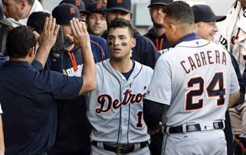 Jun 15, 2016; Chicago, IL, USA; Detroit Tigers shortstop Jose Iglesias (center) is greeted by teammates after hitting a two-run homer against the Chicago White Sox during the third inning at U.S. Cellular Field. Mandatory Credit: David Banks-USA TODAY Sports