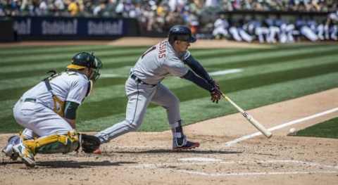 May 28, 2016; Oakland, CA, USA; Detroit Tigers shortstop Jose Iglesias (1) hits a ground ball during the fifth inning against the Oakland Athletics at Oakland Coliseum. Mandatory Credit: Kenny Karst-USA TODAY Sports