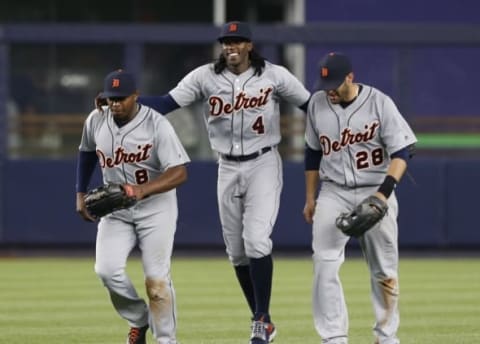 Jun 11, 2016; Bronx, NY, USA; Detroit Tigers left fielder Justin Upton (8) and center fielder Cameron Maybin (4) and right fielder J.D. Martinez (28) celebrate after defeating the New York Yankees 6-1 at Yankee Stadium. Mandatory Credit: Noah K. Murray-USA TODAY Sports